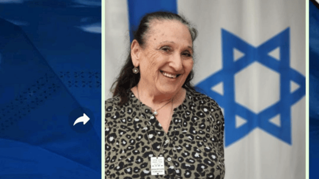 תושבת עם דגל ישראל. "אני ניצחתי"