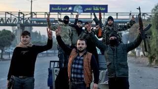 Rebeldes sirios tras el derrocamiento del régimen de Al-Assad. 