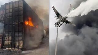 Contenedores quemados y operaciones aéreas para intentar controlar el fuego. 