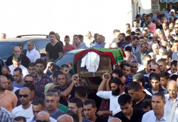 خلال تشييع جثمان شفيق كبها