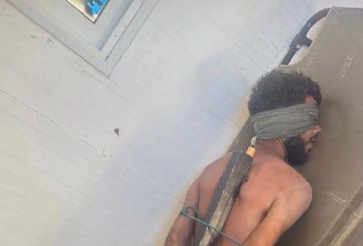 صورة لمعتقل مكبّل من غزة تثير الجدل